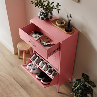 The Shoreditch shoe cabinet in flamingo with a top drawer, two lower shoe compartments and matching handles, styled in a hallway.