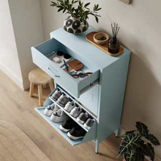 The Shoreditch shoe cabinet in sky blue with a top drawer, two lower shoe compartments and matching handles, styled in a hallway.